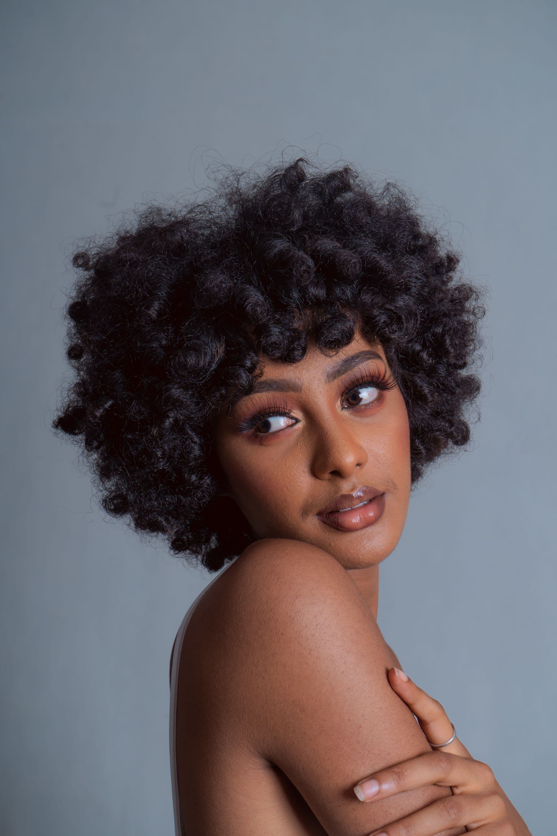 Defined natural curls styled into a rounded shape